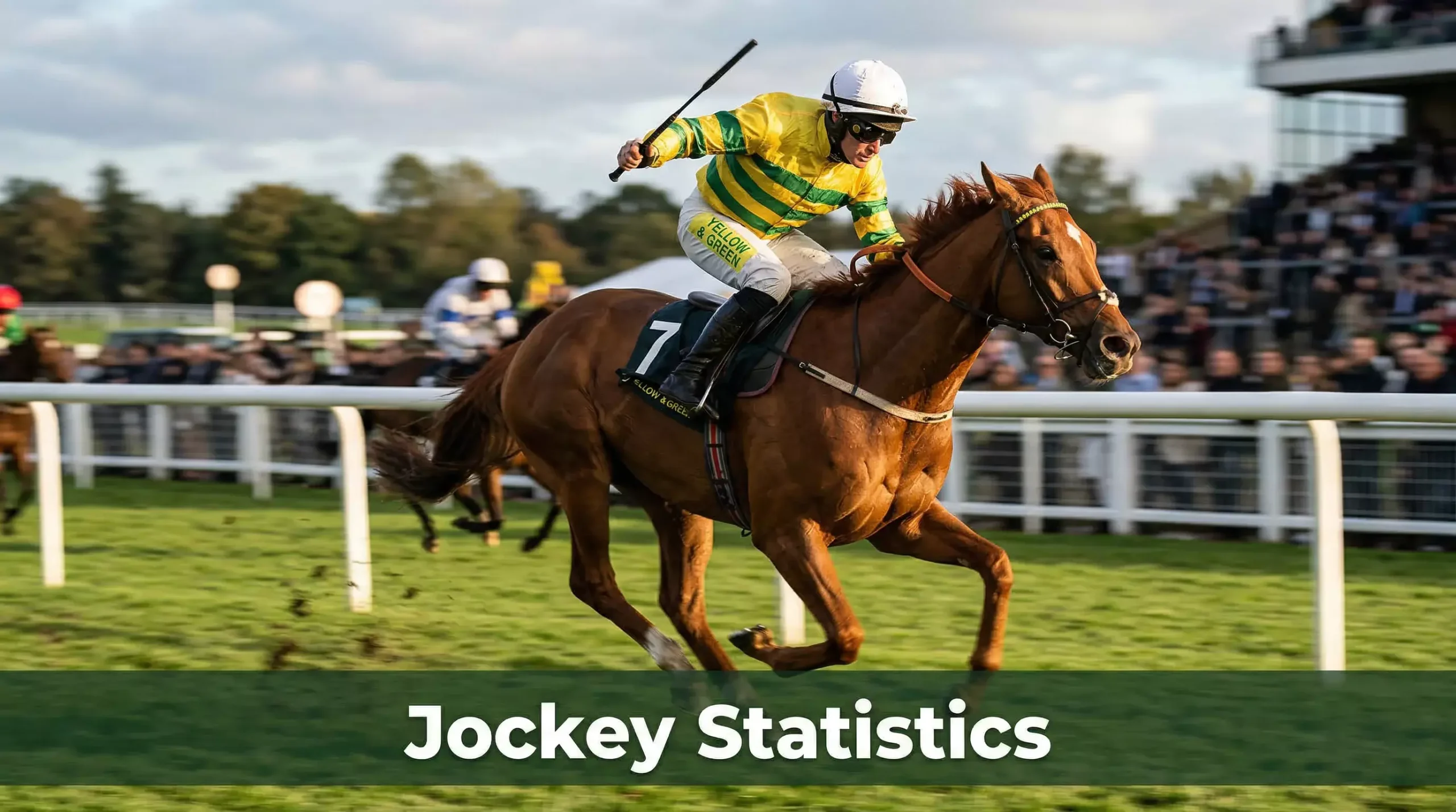 Jockey in colourful silks riding a thoroughbred at full gallop on a UK flat racecourse