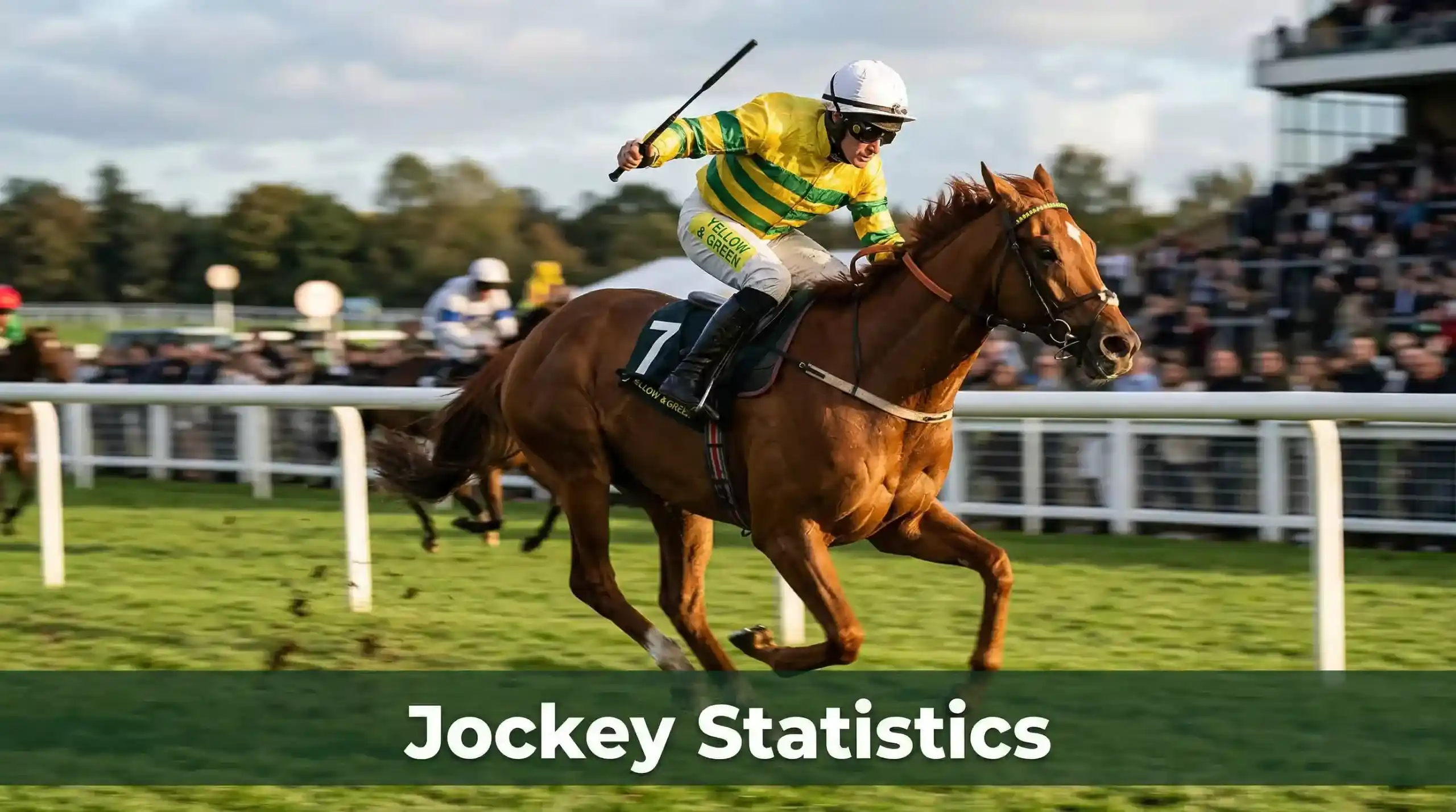 Jockey in colourful silks riding a thoroughbred at full gallop on a UK flat racecourse